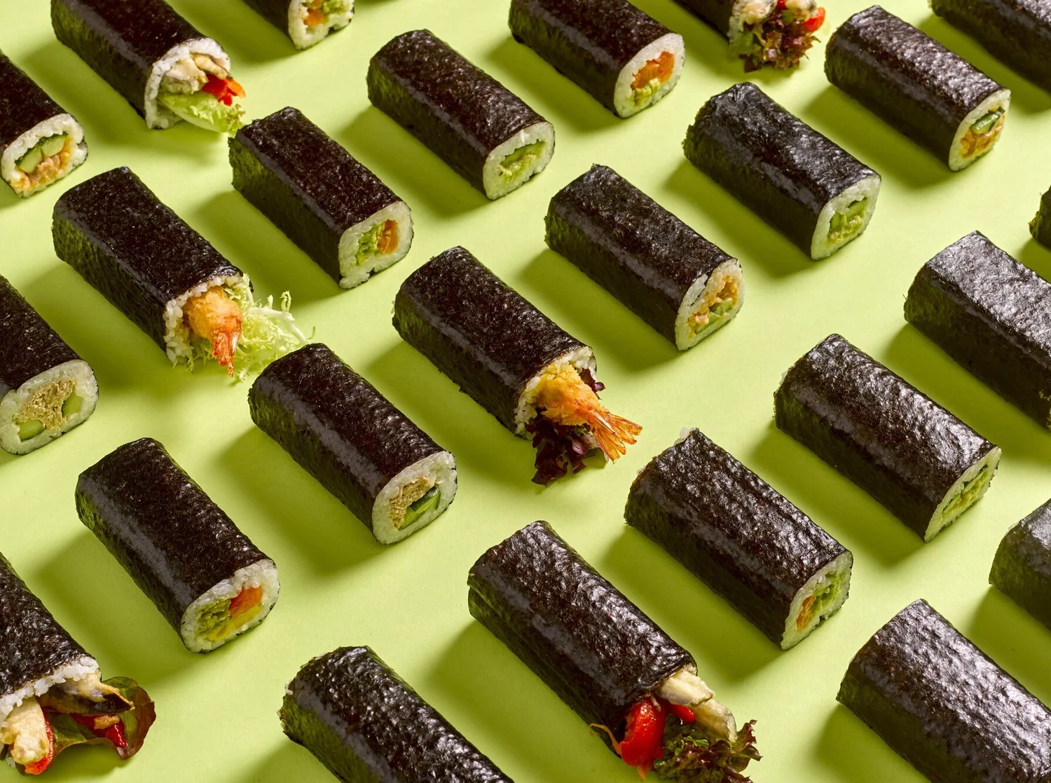 A full spread of Rolled Aussie-style sushi hand rolls